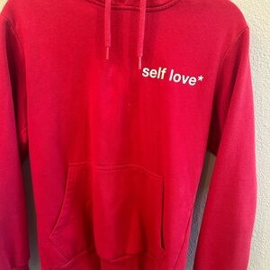 Women’s Celio Self Love red hoodie.